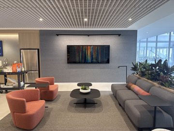 Where Health Holds displayed as a wide framed print in a NORC office lounge